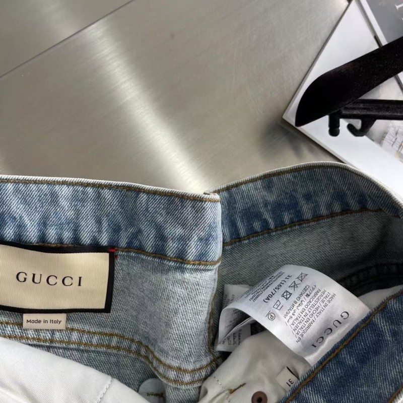 G*u*i cuffed washed jeans