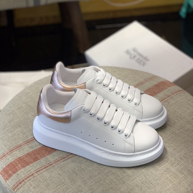 Ale*d*r M*Q*en MQ rose gold tail Sneakers