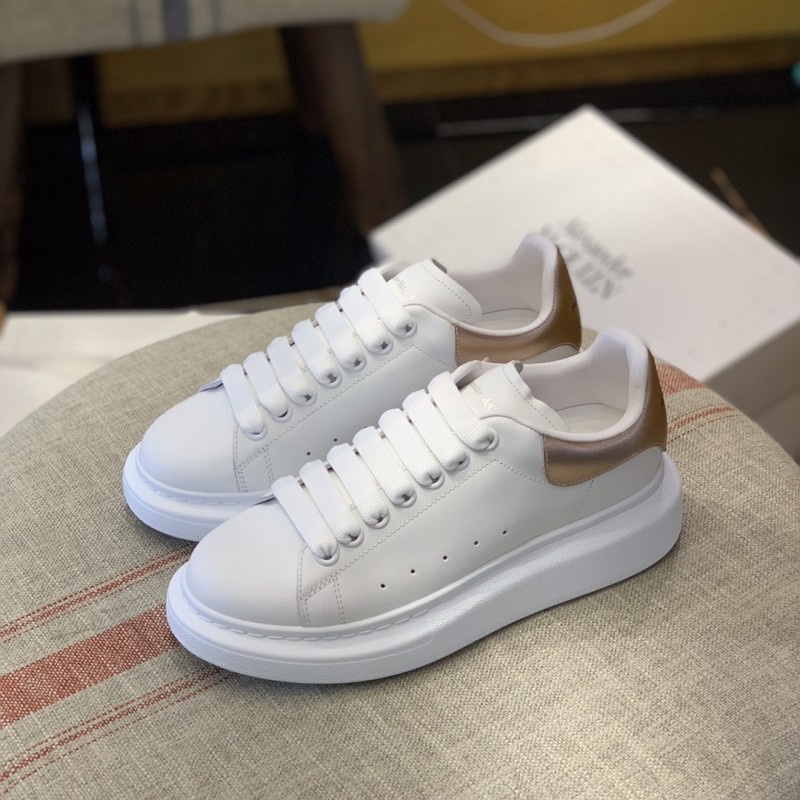 Ale*d*r M*Q*en MQ rose gold tail Sneakers